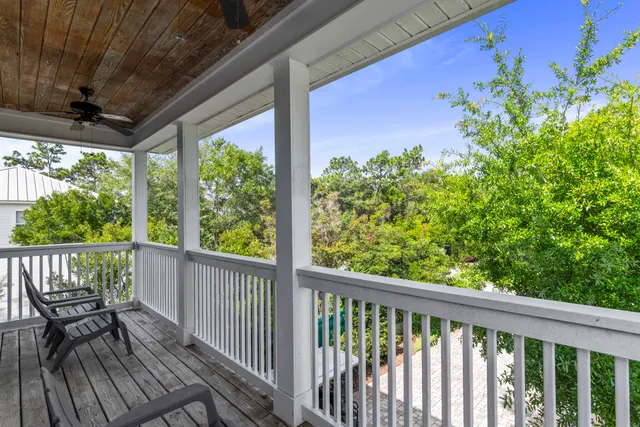 a view of a balcony with wooden floor