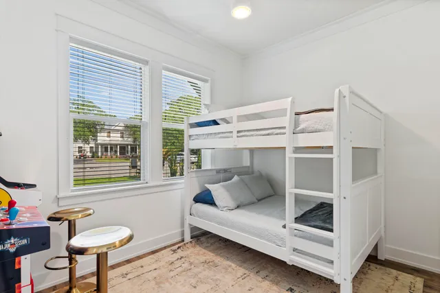 a bedroom with furniture and a window