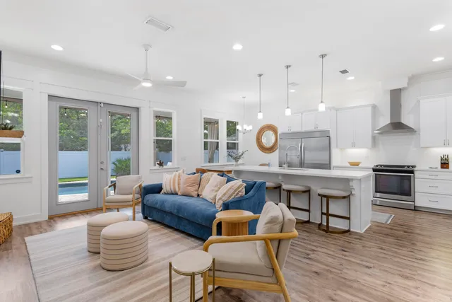 a living room with kitchen island furniture and a wooden floor