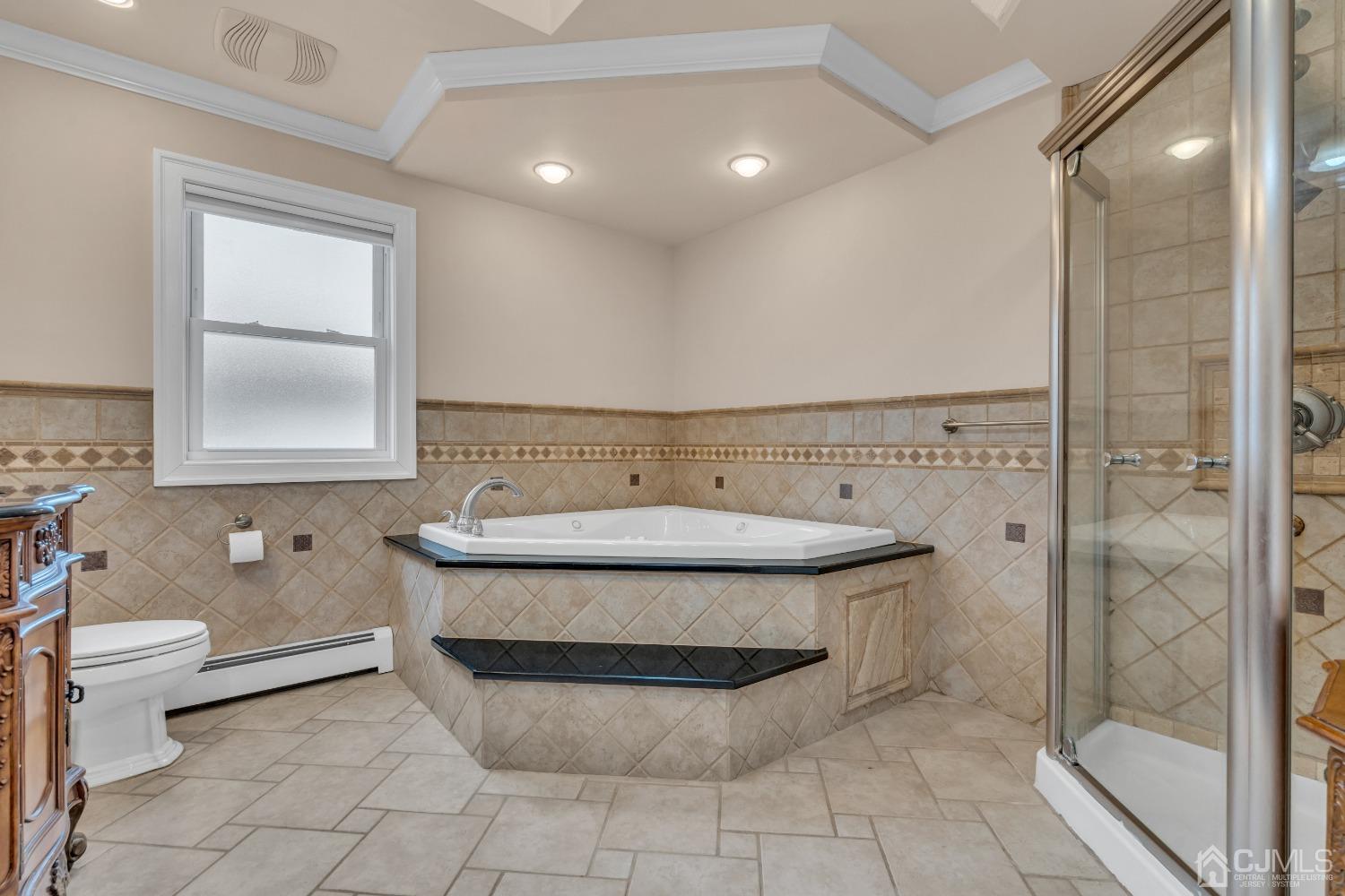 299 Fulton Street Middlesex, NJ 08846 - Photo 27 of 37 a bathroom with a toilet a sink and shower