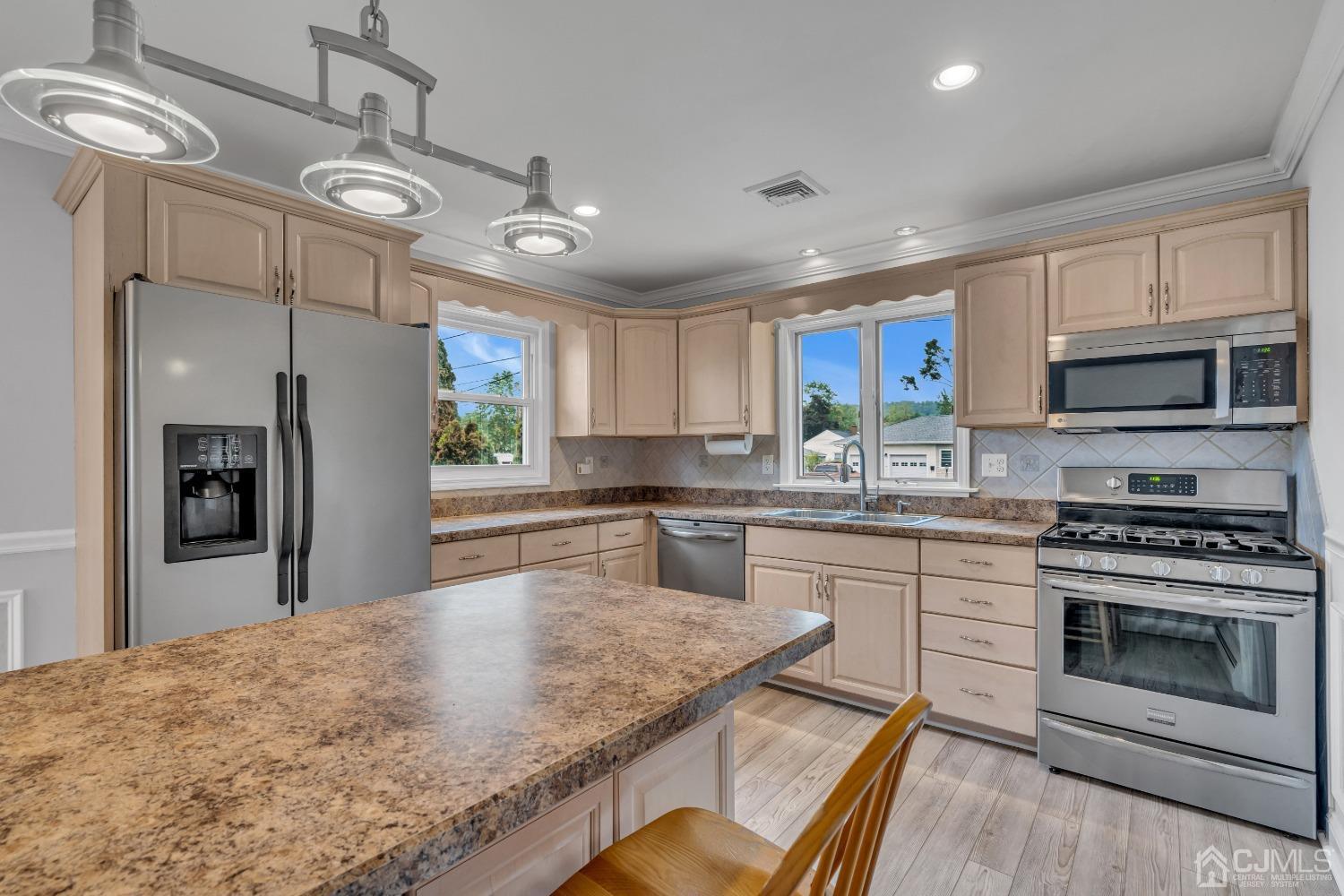 299 Fulton Street Middlesex, NJ 08846 - Photo 5 of 37 a kitchen with stainless steel appliances granite countertop a stove refrigerator sink and microwave