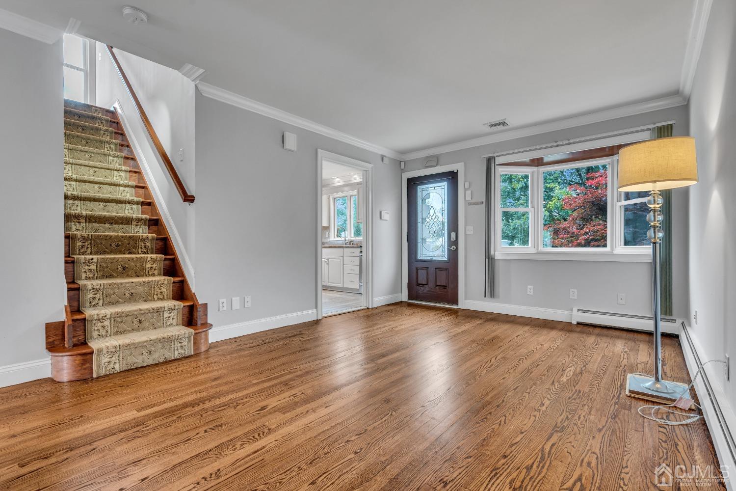 299 Fulton Street Middlesex, NJ 08846 - Photo 9 of 37 wooden floor in an empty room with a window