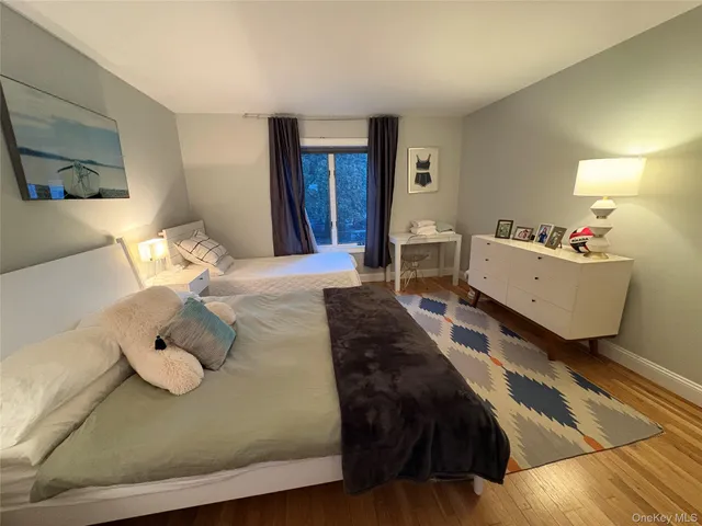 a living room with furniture and large windows