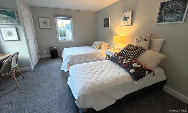 a spacious bedroom with a bed and window