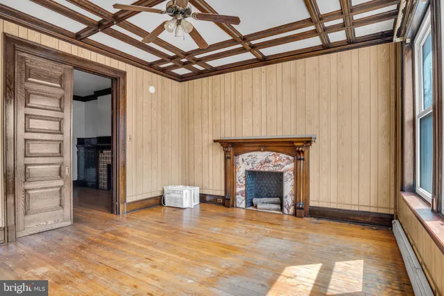 a view of a room with wooden walls