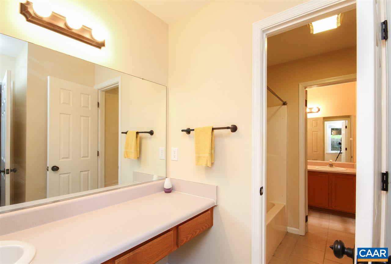 114 Riverside Drive Palmyra, VA 22963 - Photo 17 of 31 a en suite bathroom with a sink and a mirror