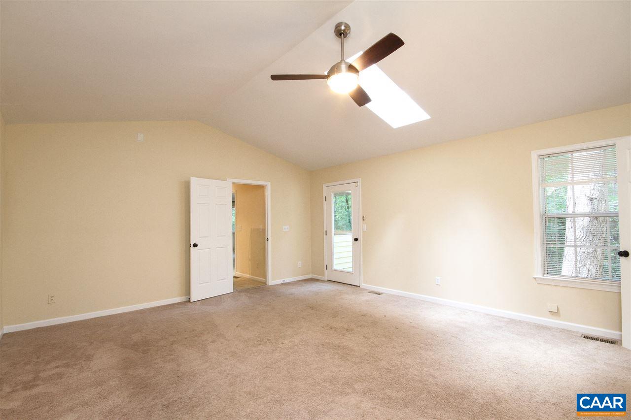 114 Riverside Drive Palmyra, VA 22963 - Photo 23 of 31 an empty room with windows and ceiling fan