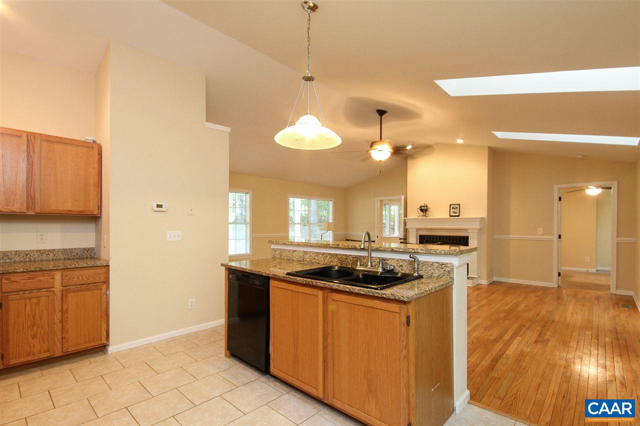 114 Riverside Drive Palmyra, VA 22963 - Photo 7 of 31 a kitchen that has a stove and a wooden cabinets