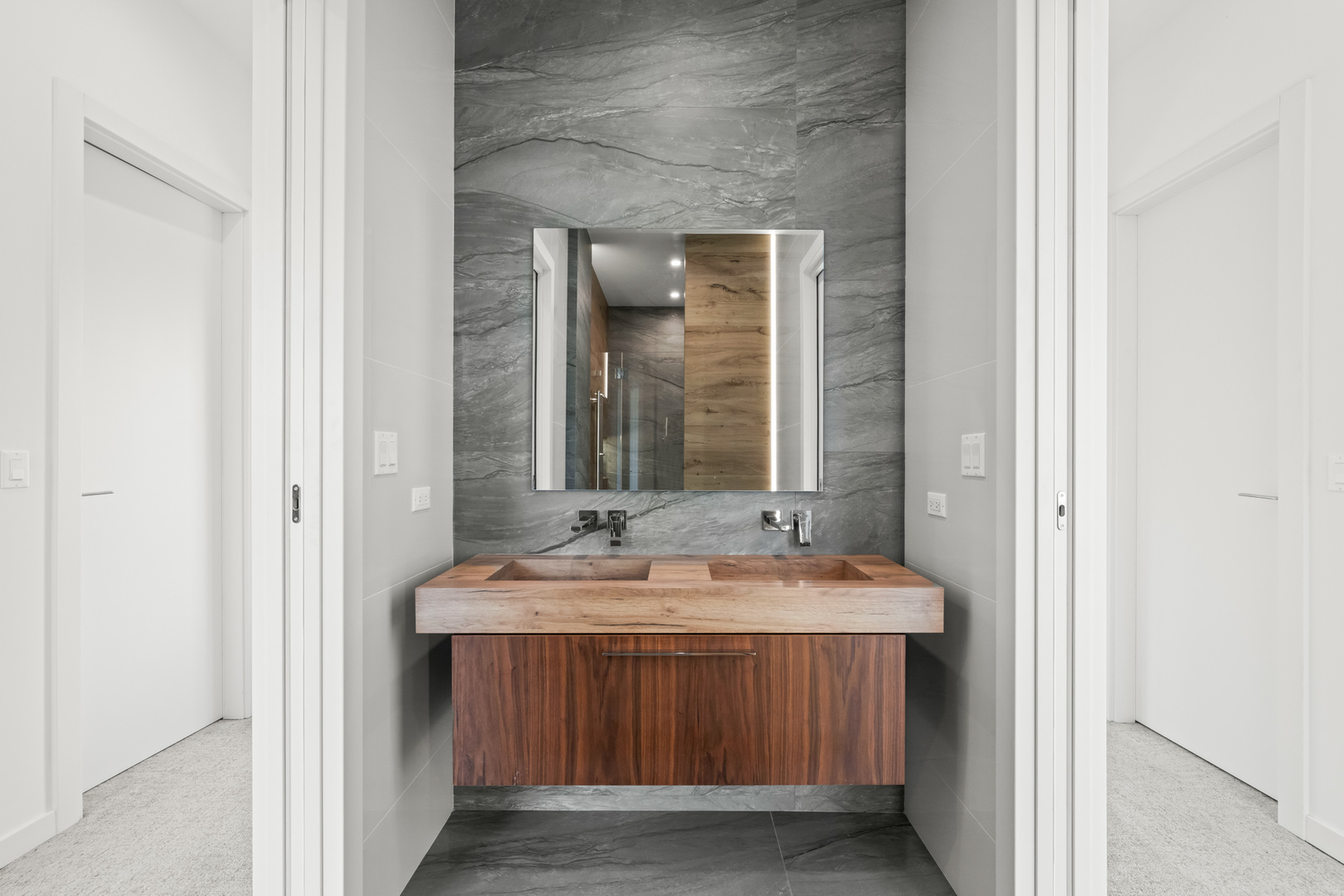 711 Becker Road Glenview, IL 60025 - Photo 64 of 85 a bathroom with a sink and a mirror