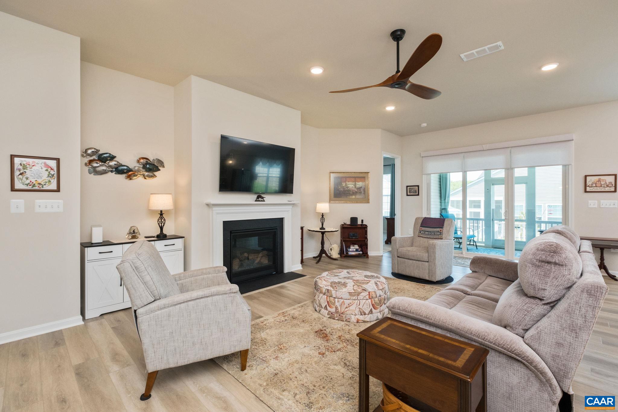 124 Stodghill Drive Ruckersville, VA 22968 - Photo 25 of 58 a living room with furniture fireplace and flat screen tv