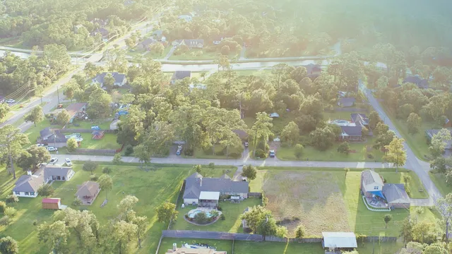 an aerial view of residential houses with outdoor space