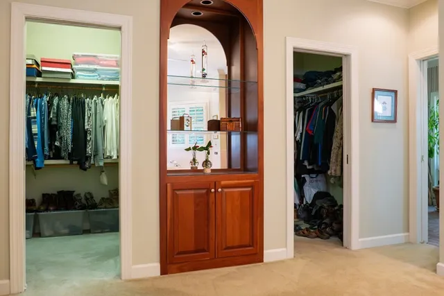 a patio with a table and chairs under an umbrella