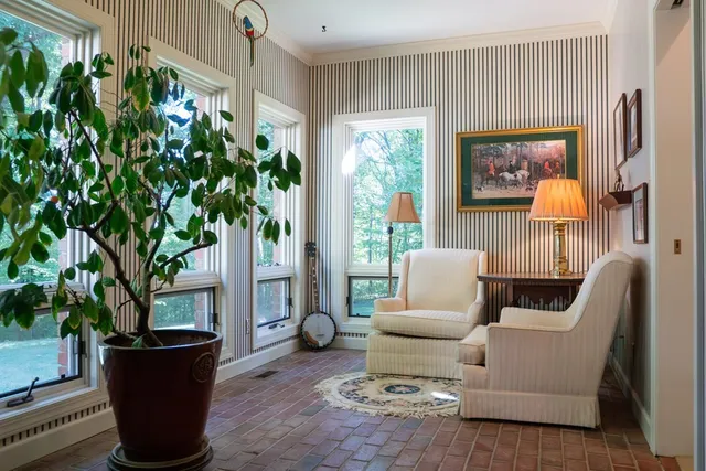 a view of hallway with wooden floor