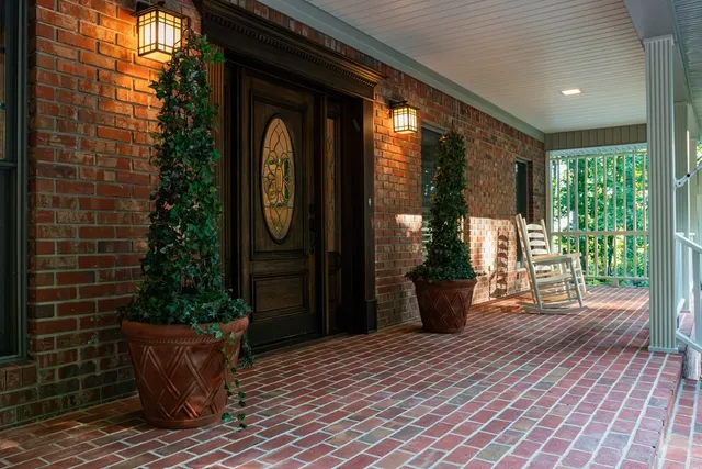 a wooden bench sitting in front of a building