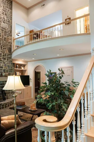 a front view of a house with sitting area