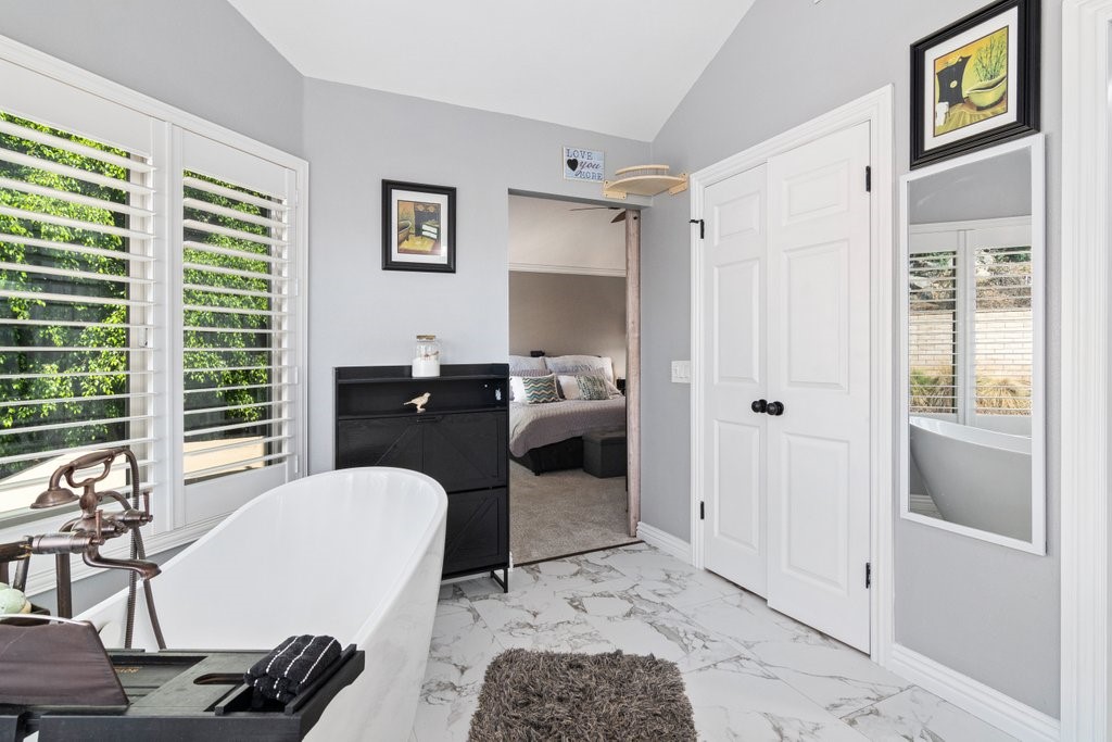 8251 Bent Tree Lane Riverside, CA 92509 - Photo 28 of 57 Primary bathroom with scenic views and separate bathtub and shower