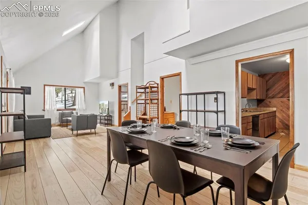a kitchen with a refrigerator and a sink