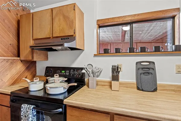 a kitchen with a stove and a microwave