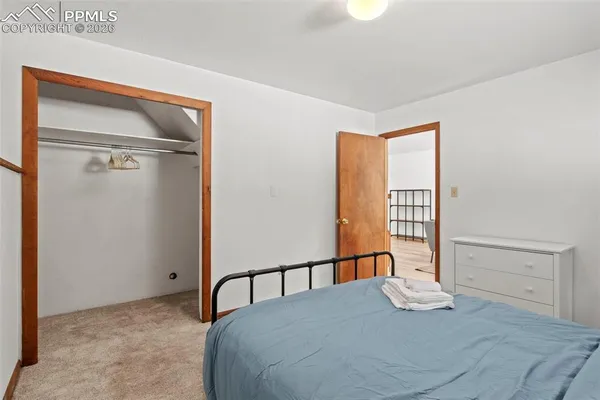 a bedroom with a bed and a table