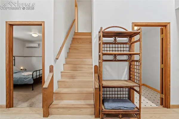 a bedroom with a bed and a mirror