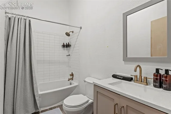 a bedroom with a bed and a table