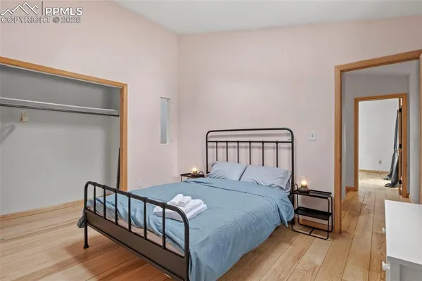 a view of a room with furniture and wooden floor