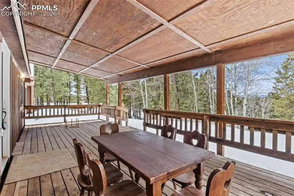 a view of balcony with wooden floor