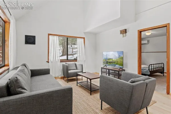 a living room with furniture and a window