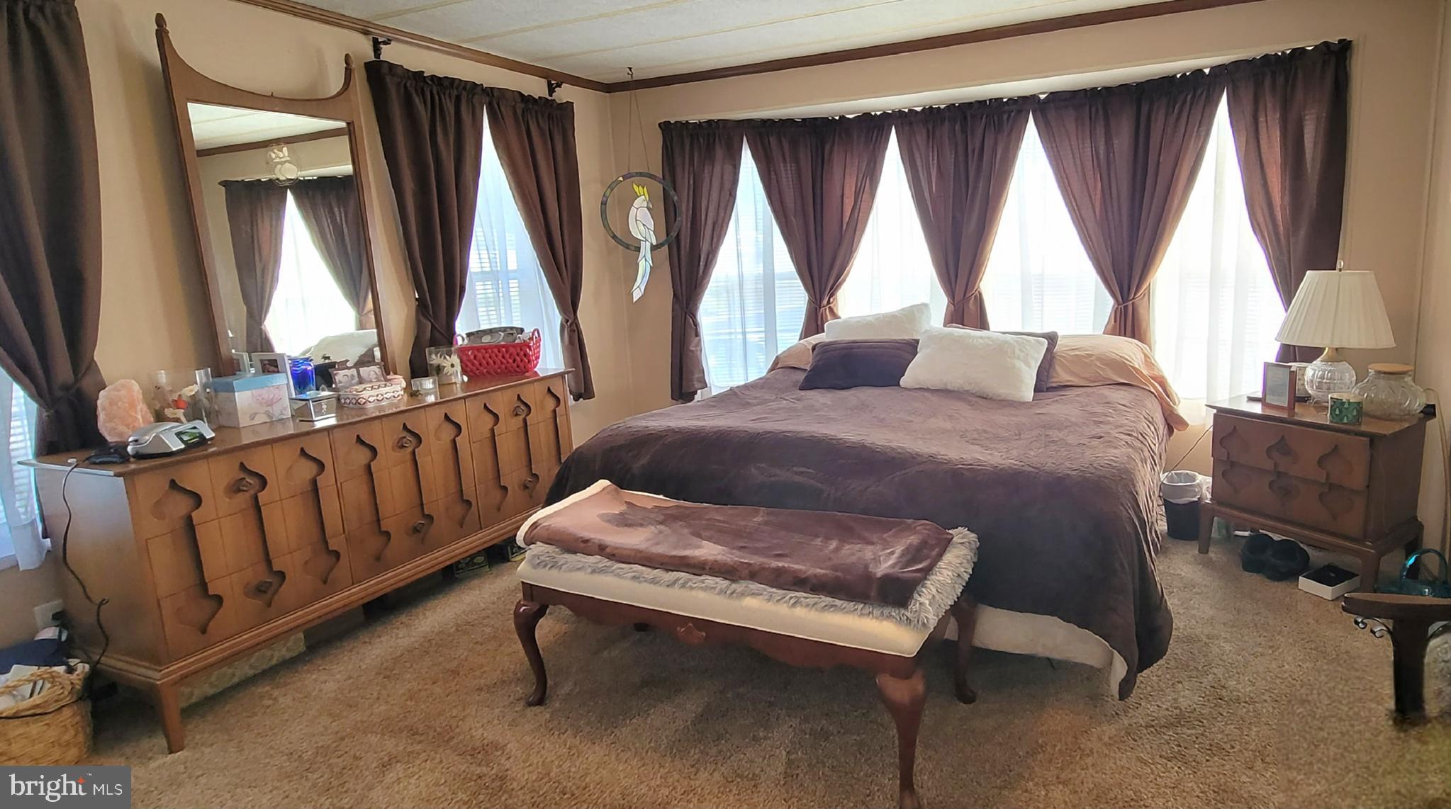 330 John Alden Drive Buena, NJ 08310 - Photo 11 of 16 a bedroom with a bed and large windows