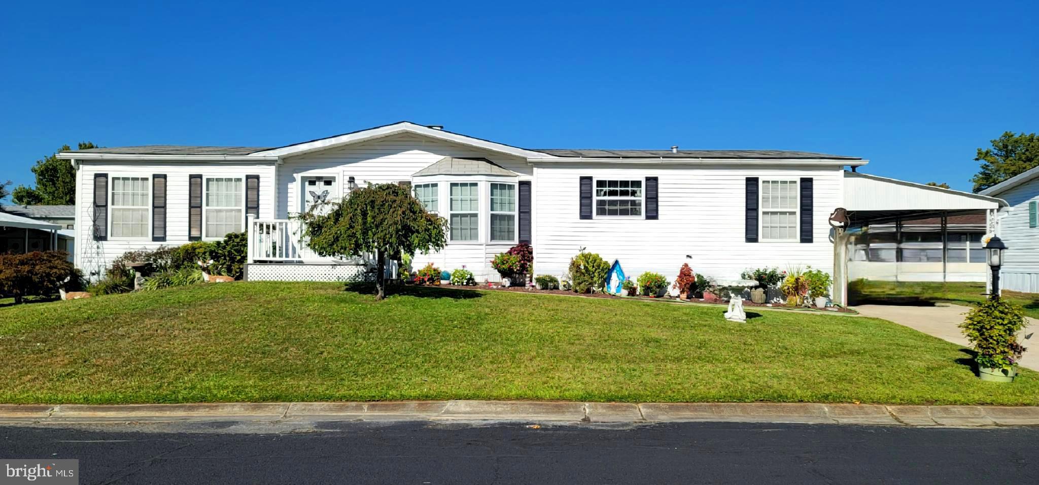 330 John Alden Drive Buena, NJ 08310 - Photo 13 of 16 a front view of a house with a yard
