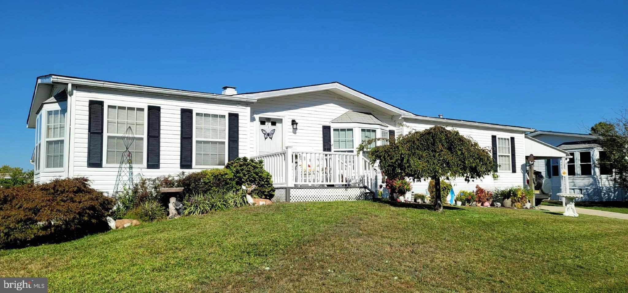 330 John Alden Drive Buena, NJ 08310 - Photo 15 of 16 a front view of a house with garden