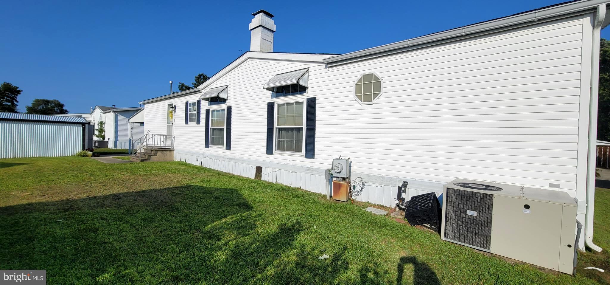 330 John Alden Drive Buena, NJ 08310 - Photo 16 of 16 a front view of a house with a yard