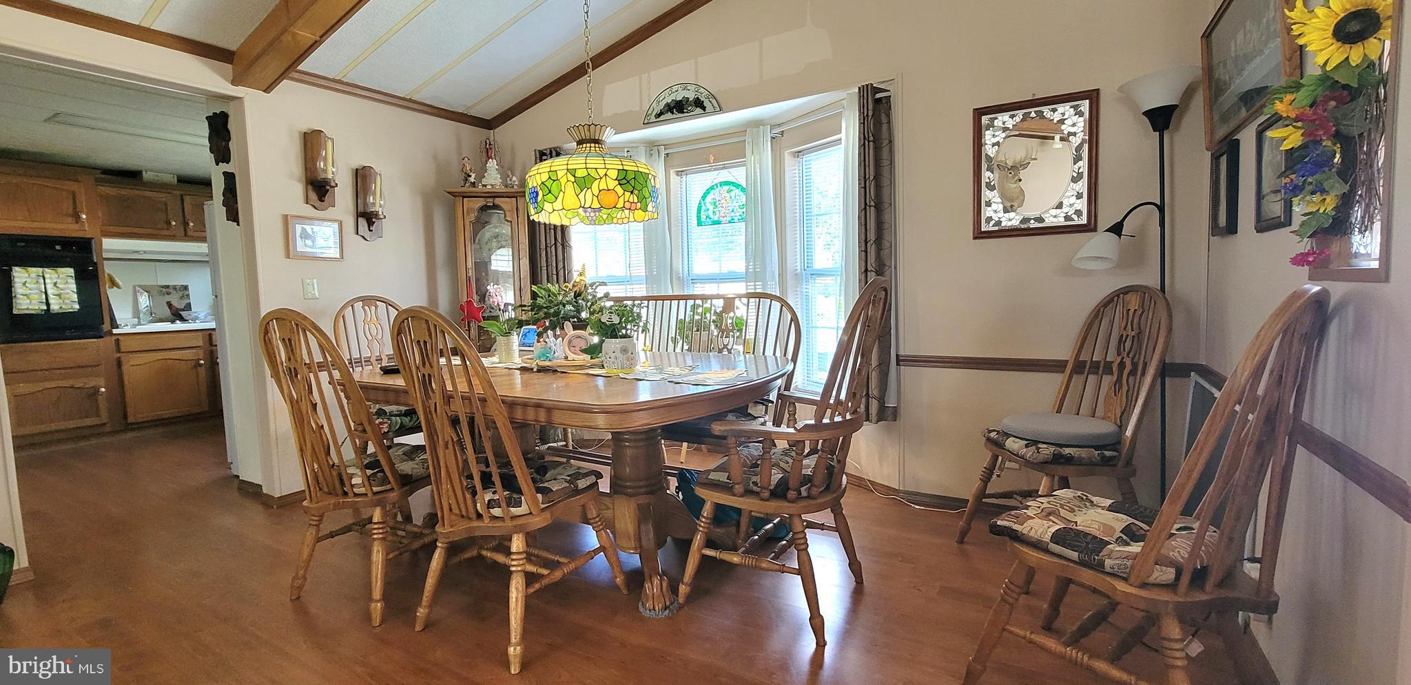 330 John Alden Drive Buena, NJ 08310 - Photo 4 of 16 a view of a dining room with furniture and a window