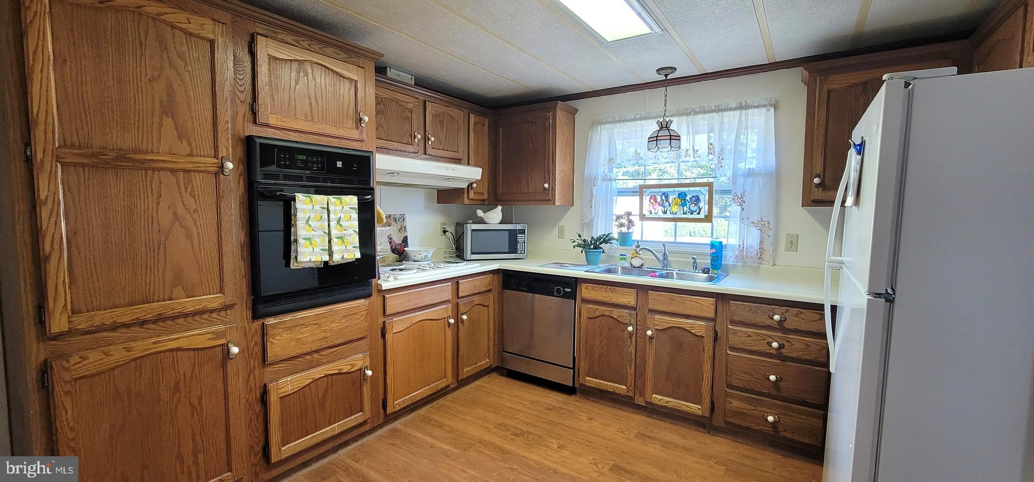 330 John Alden Drive Buena, NJ 08310 - Photo 5 of 16 a kitchen with stainless steel appliances granite countertop a refrigerator and a sink