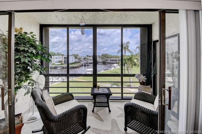 1950 Southwest Palm City Road, Unit 3209 Stuart, FL 34994 - Photo 12 of 64 Screened and enclosed patio.