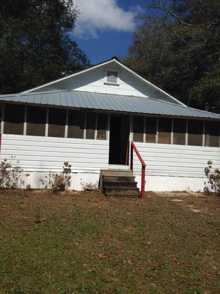 70 Squirrel Road DeFuniak Springs, FL 32433 - Photo 1 of 1 a front view of a house with a yard