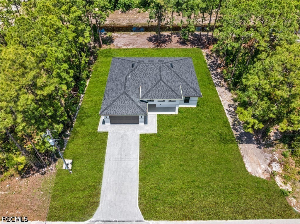 507 Trinity Street East Lehigh Acres, FL 33974 - Photo 1 of 50 an aerial view of a house