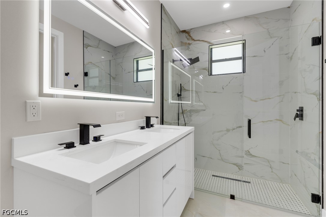 507 Trinity Street East Lehigh Acres, FL 33974 - Photo 41 of 50 a bathroom with a sink a toilet and shower