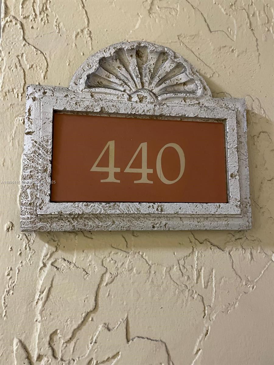 8100 Geneva Court, Unit 440 Doral, FL 33166 - Photo 11 of 11 a blue sign that is sitting on a floor