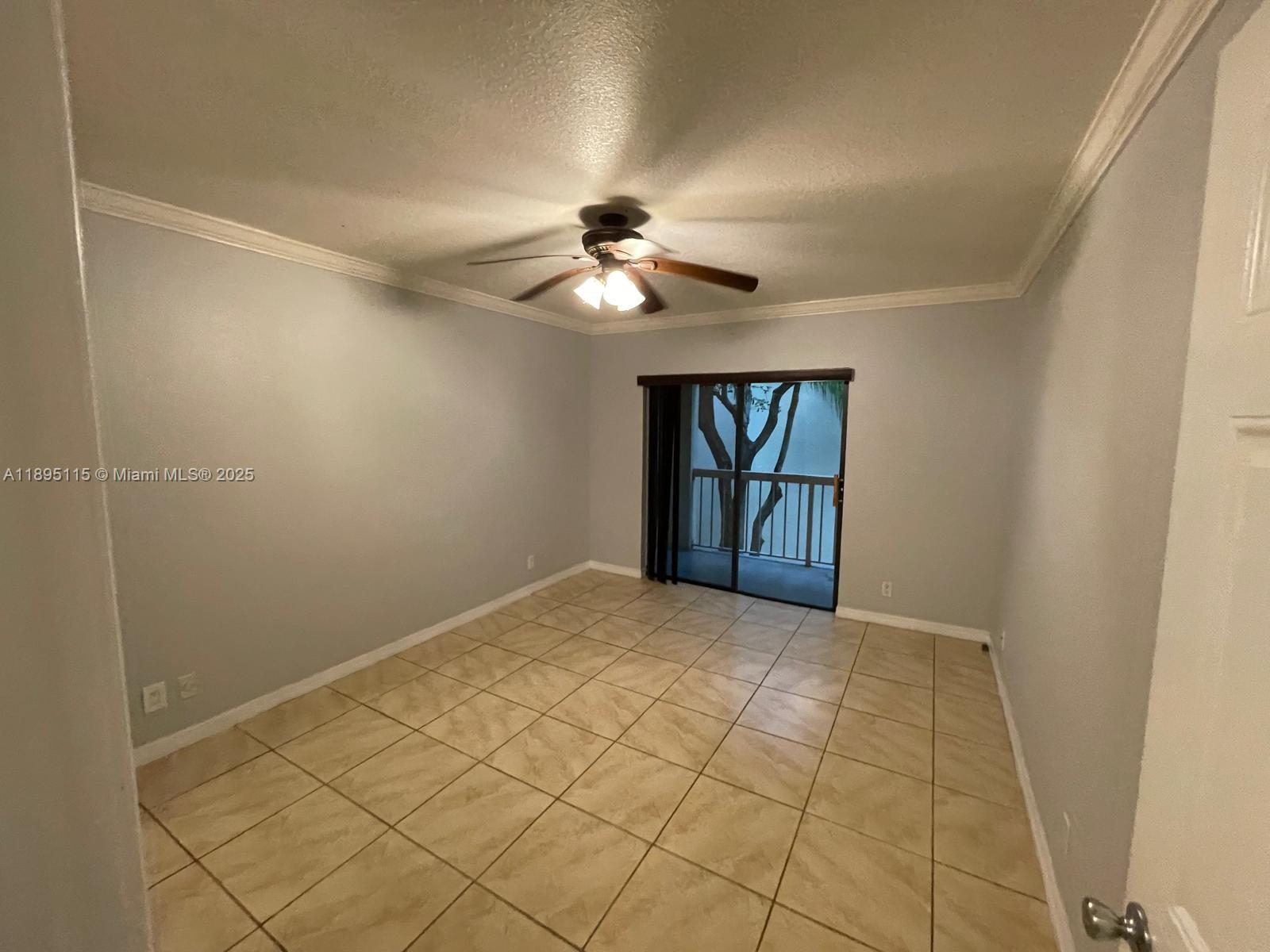 8100 Geneva Court, Unit 440 Doral, FL 33166 - Photo 4 of 11 a view of empty room with windows