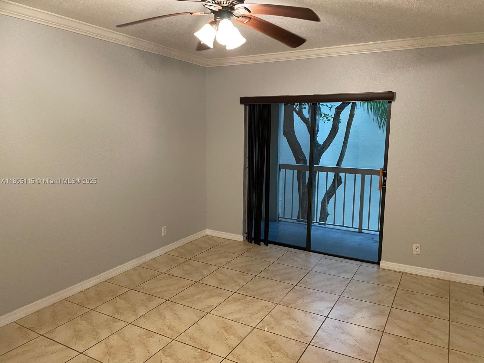 8100 Geneva Court, Unit 440 Doral, FL 33166 - Photo 5 of 11 an empty room with windows