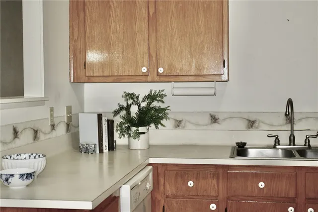 a kitchen with a sink and cabinets
