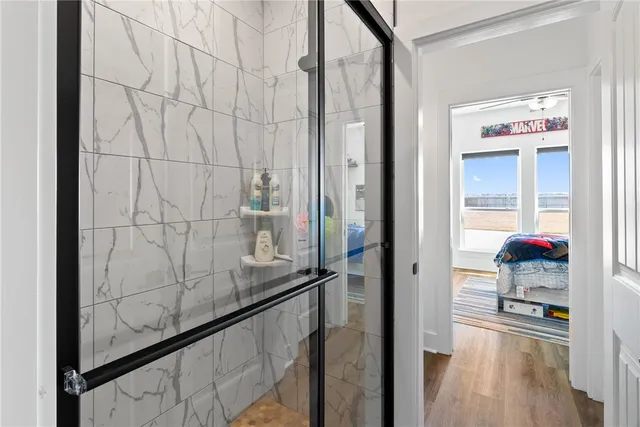 a view of a living room and bathroom