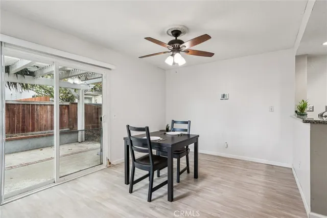 a view of a dining room with furniture and chandelier