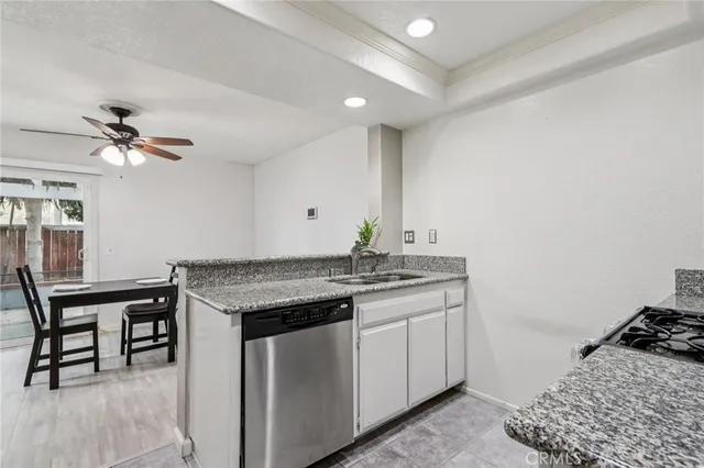 a kitchen with a stove and cabinets
