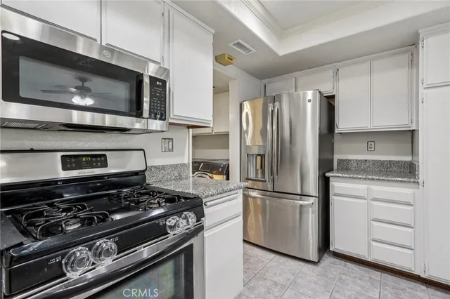 a kitchen with a stove microwave and refrigerator