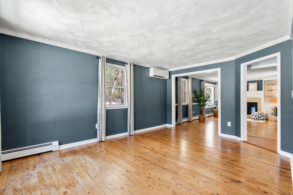370 Peakham Road Sudbury, MA 01776 - Photo 11 of 41 a view of an empty room with wooden floor and a window