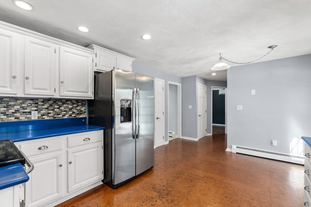 370 Peakham Road Sudbury, MA 01776 - Photo 16 of 41 a kitchen with stainless steel appliances a refrigerator and a stove top oven