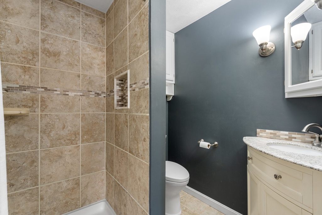 370 Peakham Road Sudbury, MA 01776 - Photo 25 of 41 a bathroom with a sink a toilet and shower