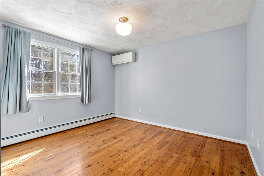 370 Peakham Road Sudbury, MA 01776 - Photo 27 of 41 a view of empty room with wooden floor and fan